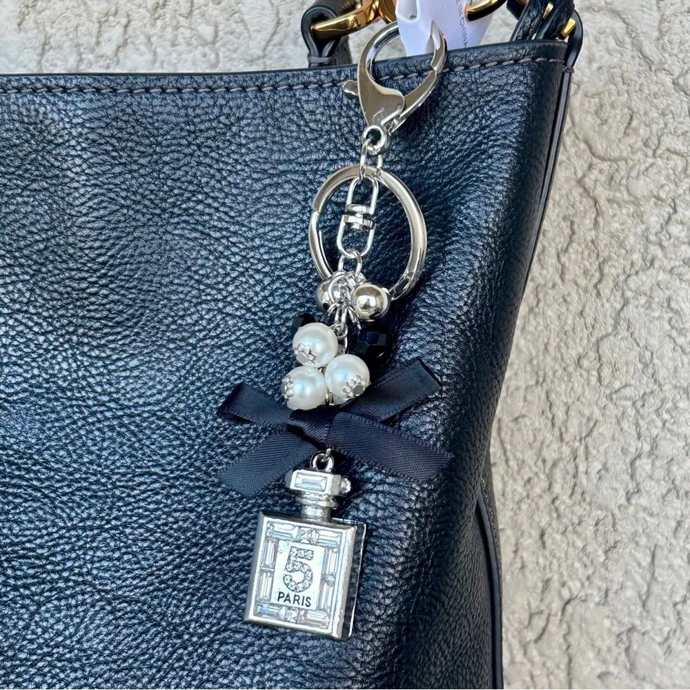 Luxe Silver Perfume Bottle Keychain/Bag Charm with Black Bow